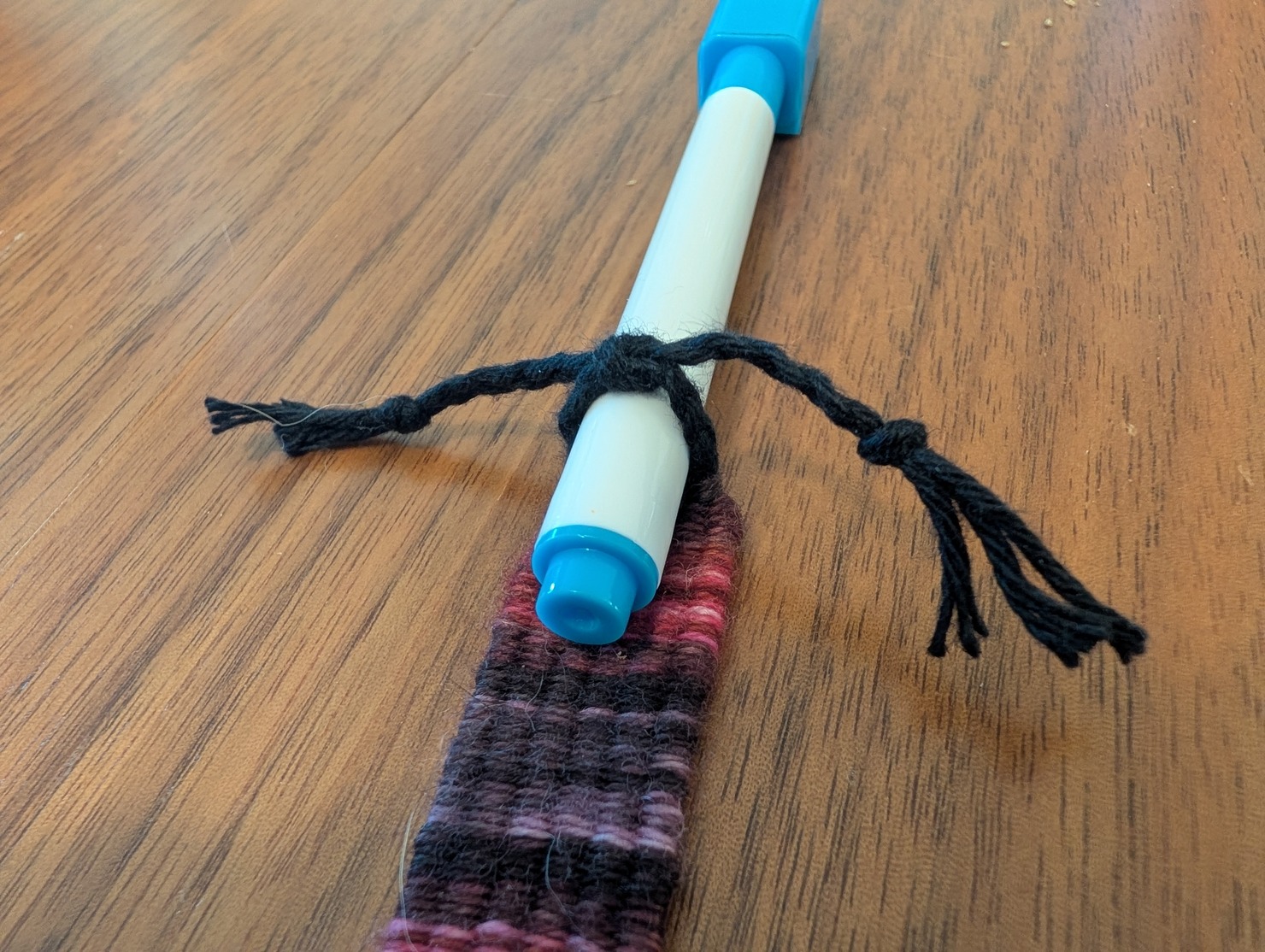 photo of the warp braids tied around a tube